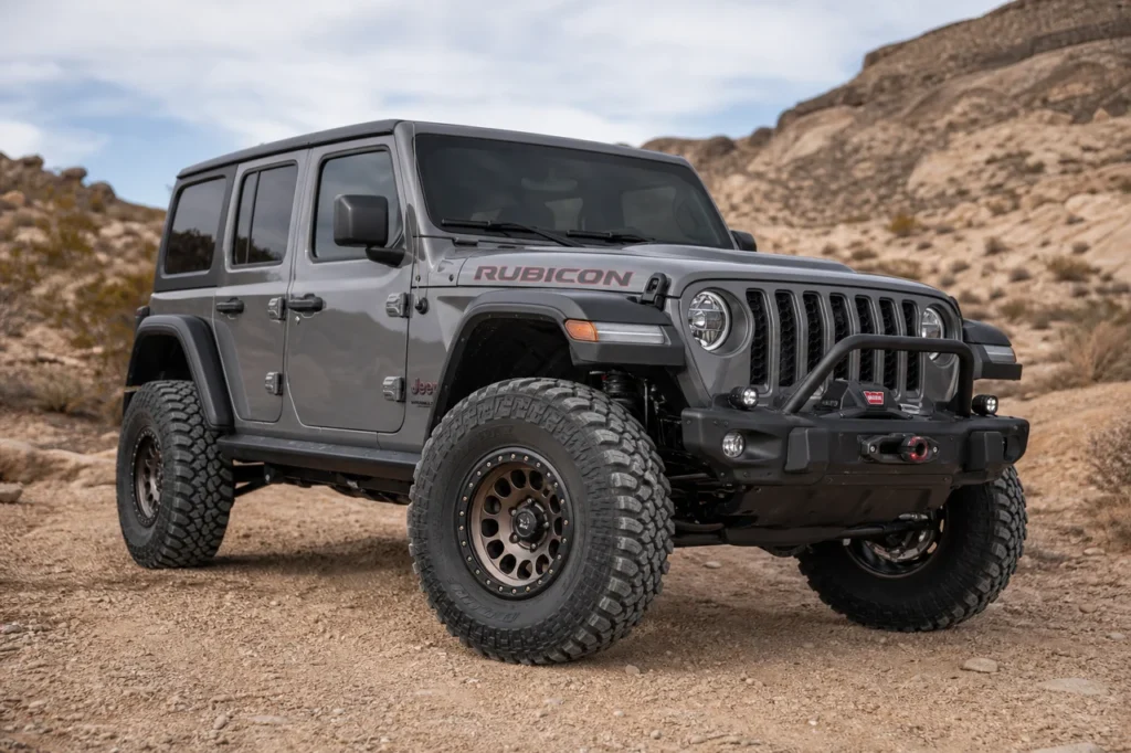 Jeep Wrangler JL with beadlock style 17 inch off road wheels on a desert trail