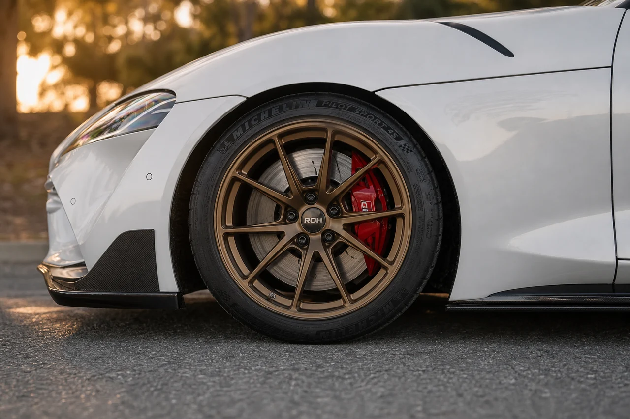 Matte Black vs Bronze Wheels: Best Color for a White Car supra bronze wheel closeup