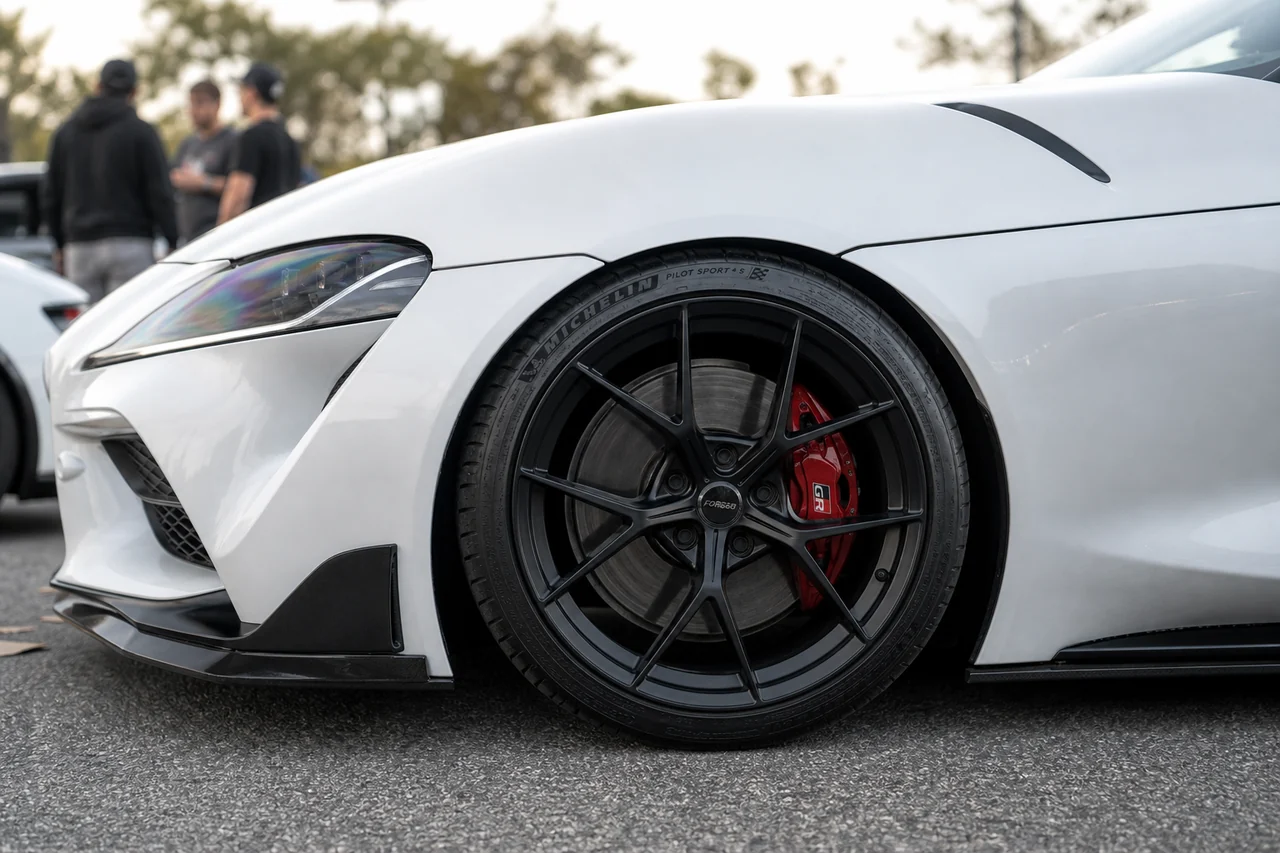 Matte Black vs Bronze Wheels: Best Color for a White Car supra matte black wheel closeup