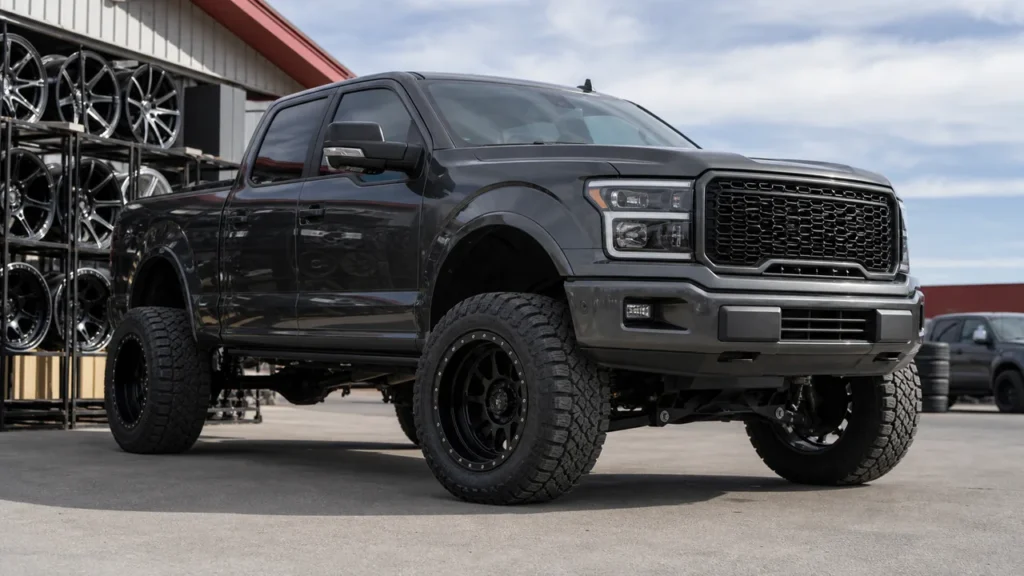 Lifted truck with clean wheel offset and flush fitment in realistic outdoor lighting